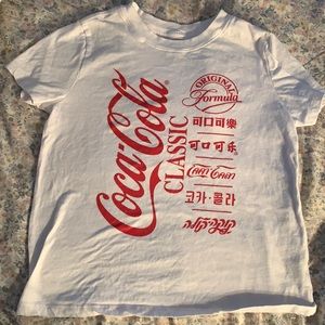 Coca Cola shirt with it in different languages